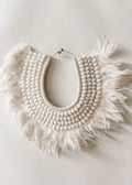 Schelpen en veren ketting